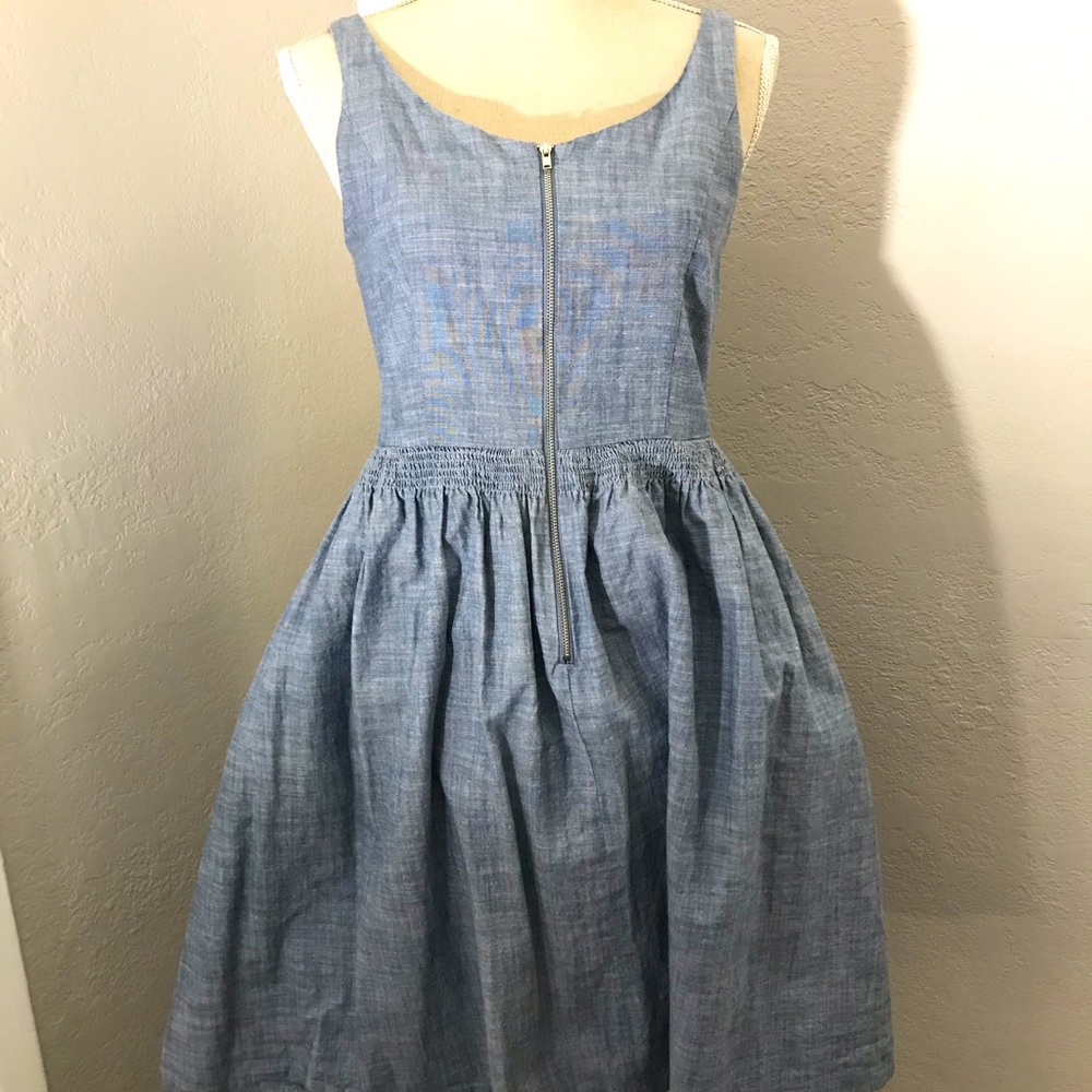Denim, knee length full skirted dress.